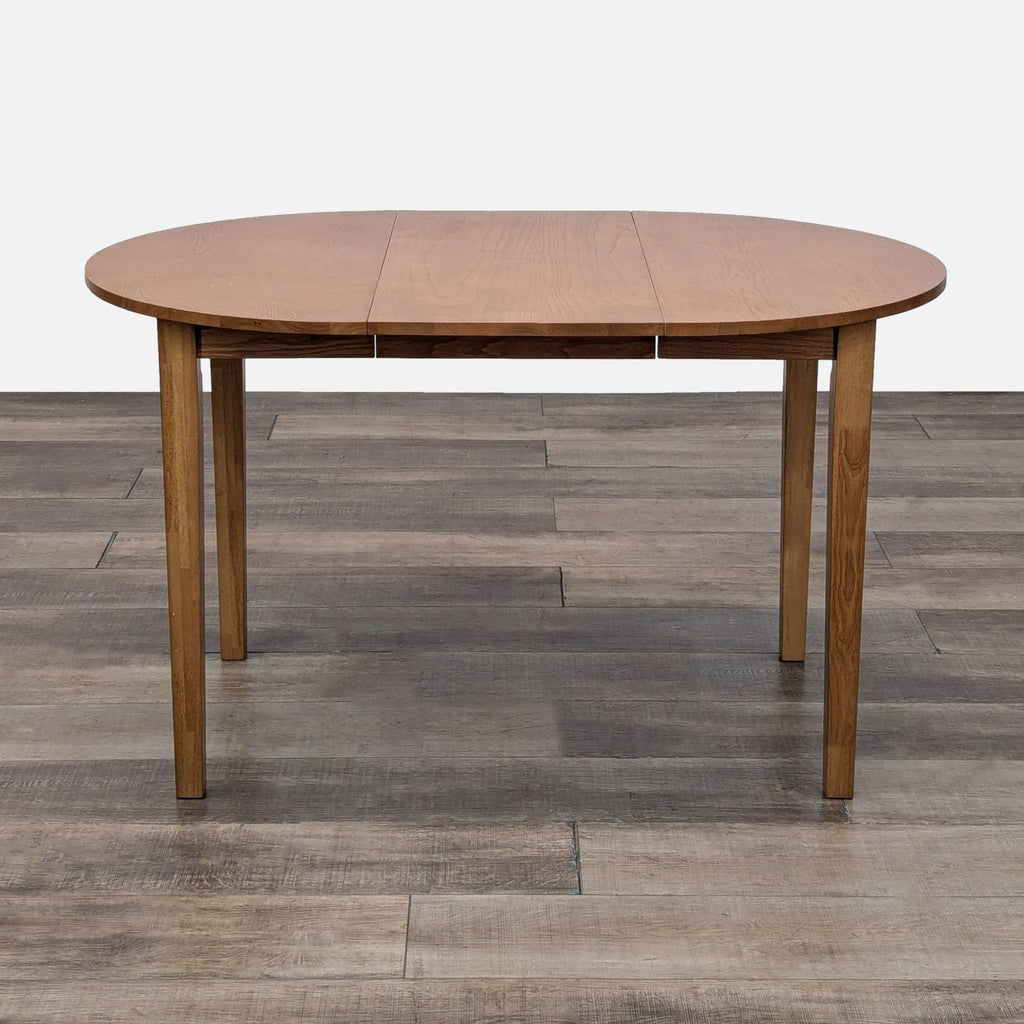 Litfad dining table extended with a 15.75 inch leaf.