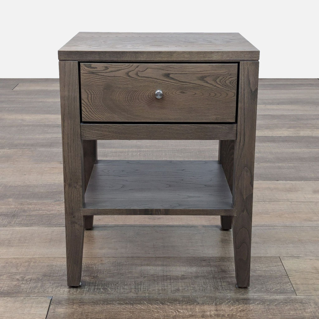 Room & Board end table with a drawer and lower shelf in brown wood finish.