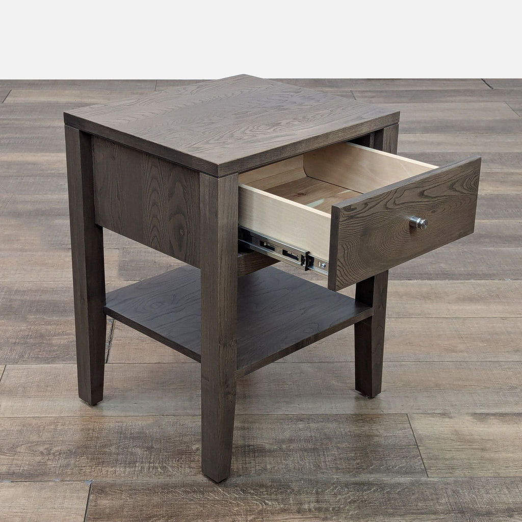 Open drawer view of Room & Board end table with exposed light wood interior.