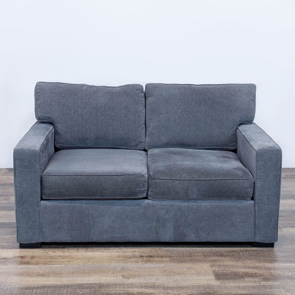 Gray loveseat with textured upholstery and mocha-finished legs, viewed from the front.