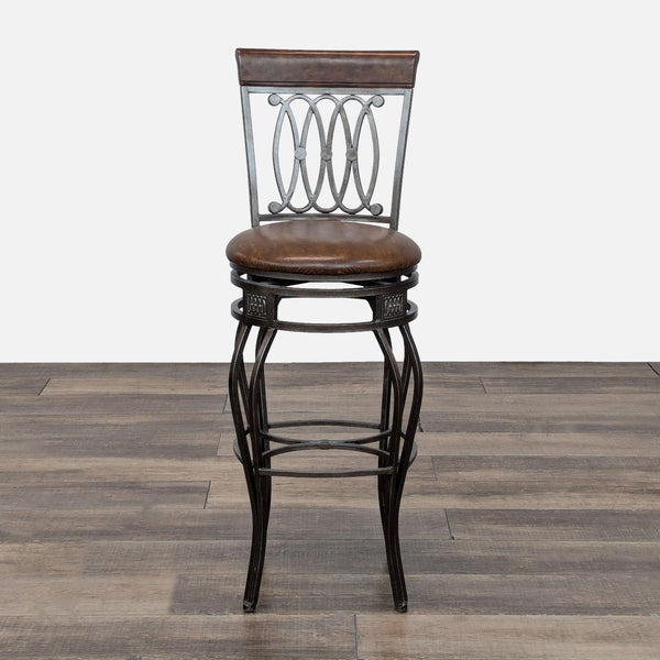 Front view of a Reperch stool with a metal frame and cushioned seat on a wooden floor.