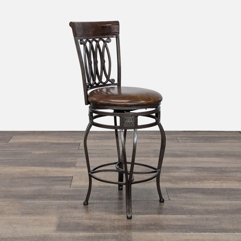 Metal frame stool from Reperch, side view shows intricate backrest and rounded seat.