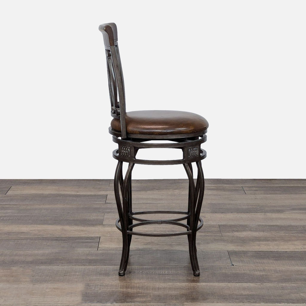 Elegant Reperch stool with ornate backrest, dark finish, and cushioned circular seat.