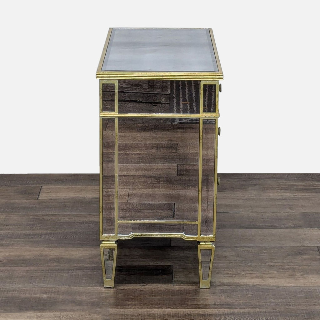 Open dresser with mirrored fronts and gold hardware.