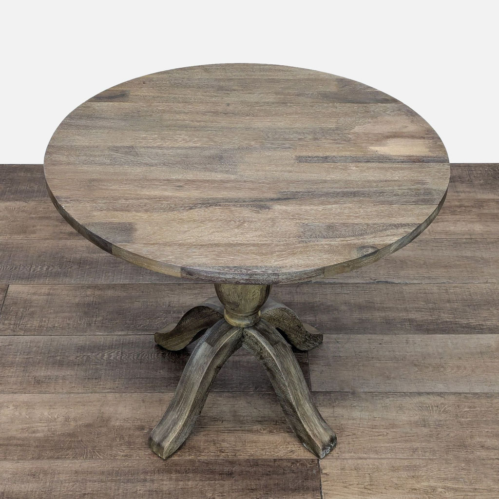 Top view of circular dining table, showcasing wood grain and craftsmanship.