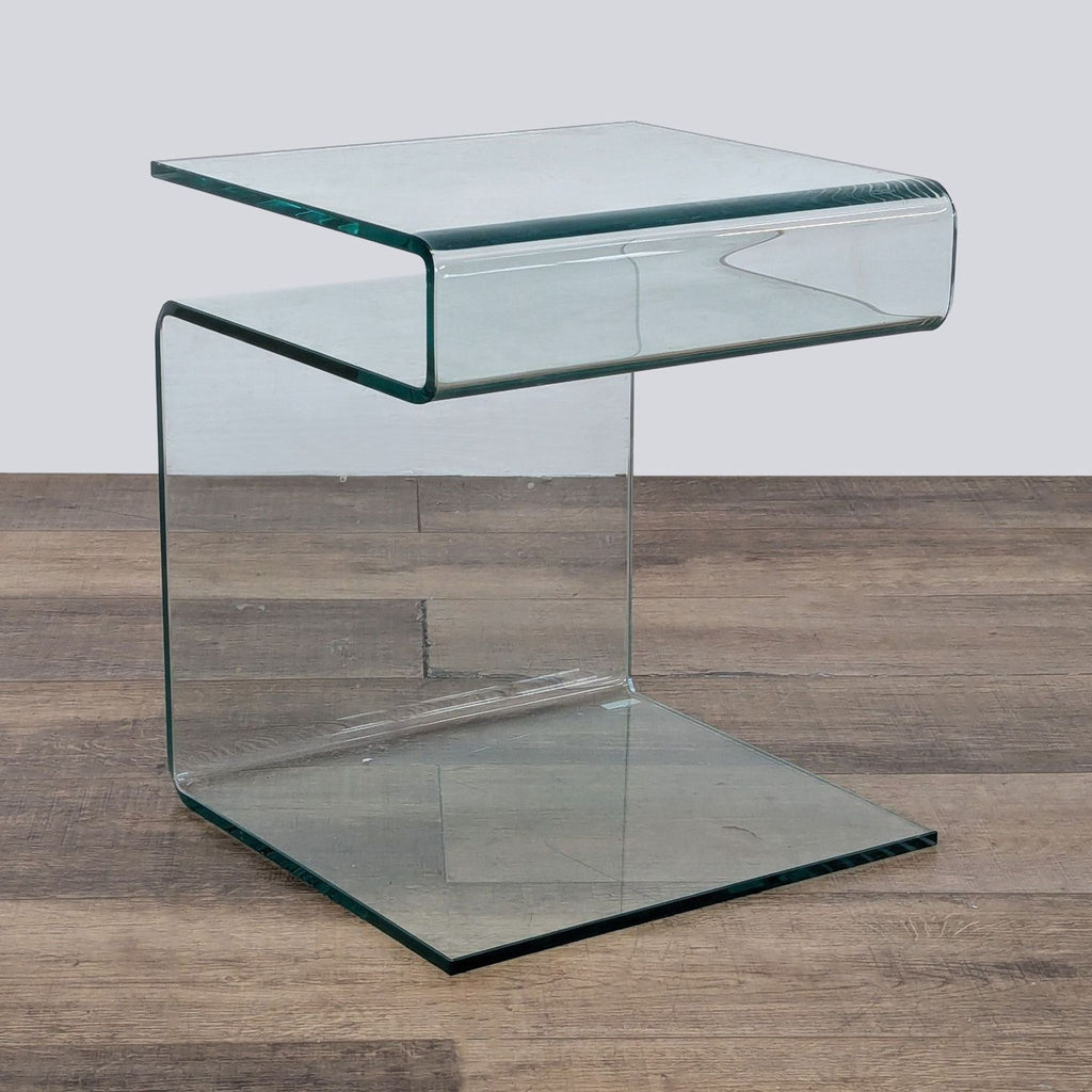 Transparent glass console table by Reperch, featuring a sleek, minimalist shape.