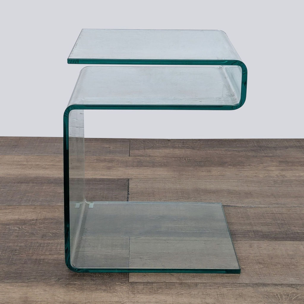 Reperch Side Table with modern, clear glass design on a wood floor background.