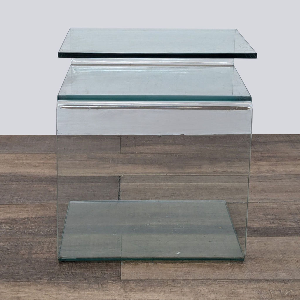 Contemporary glass side table by Reperch, emphasizing a clean, streamlined form.