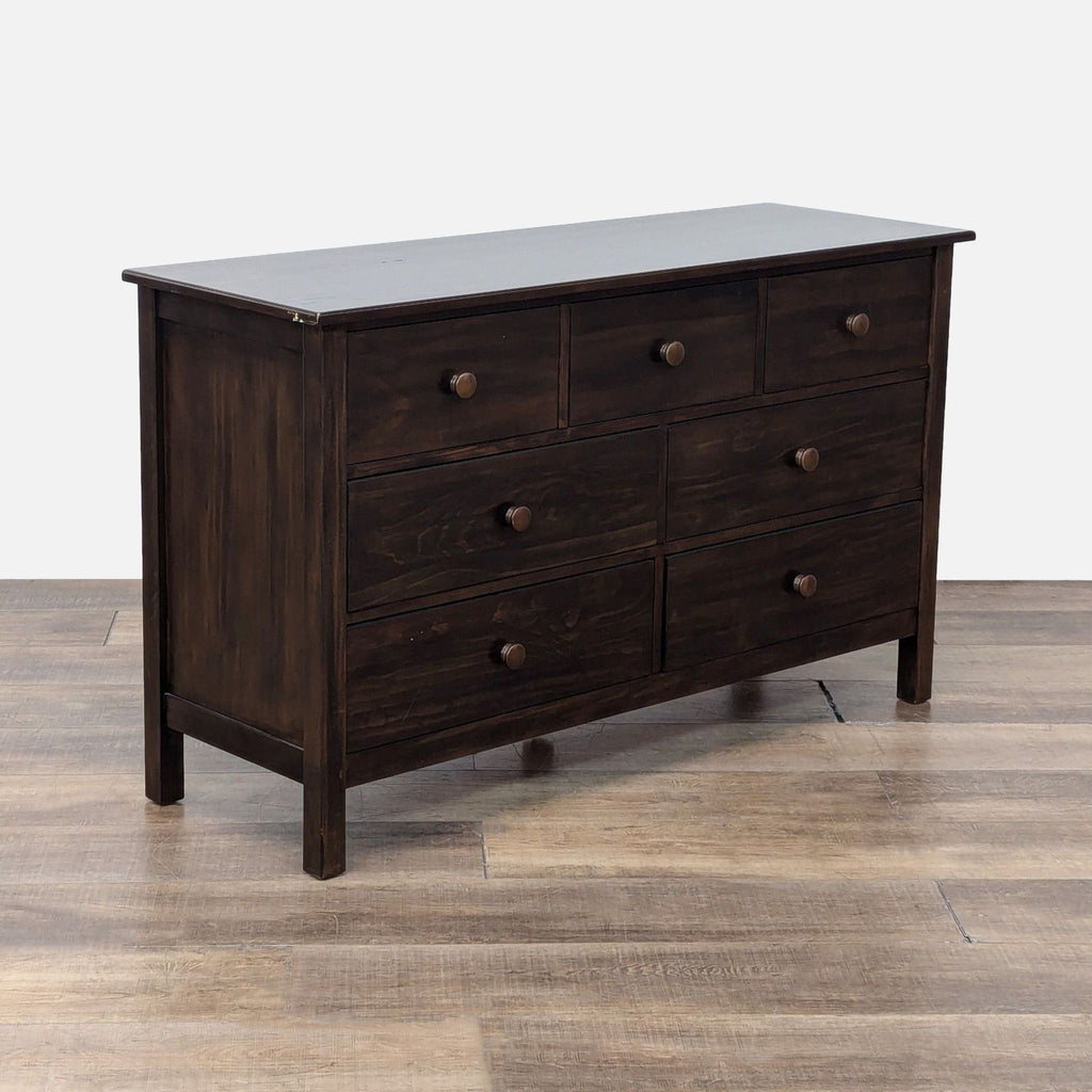 Angled view of the wooden Kendall Dresser highlighting its spacious design and sturdy build.