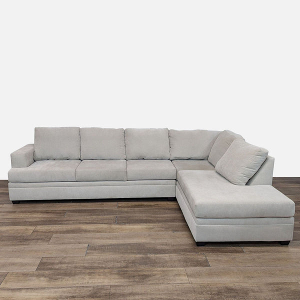 Gray Bonaterra sectional with chaise, wide track arms, and chenille fabric from Living Spaces.