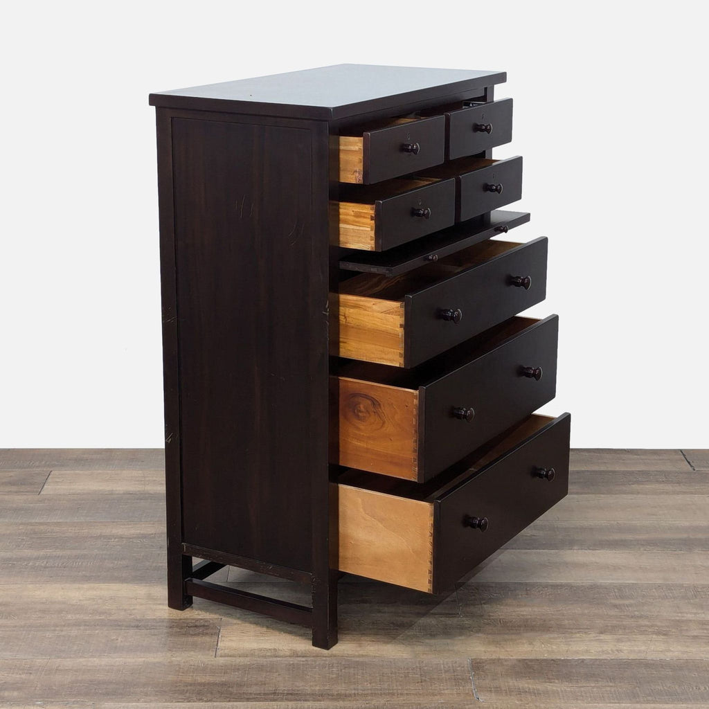 Side view of open dresser showcasing 4 small and 3 large drawers, highlighting wood finish.