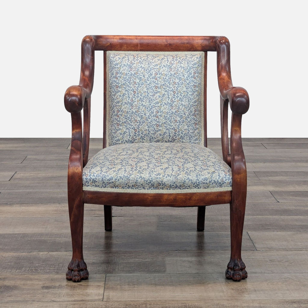 Empire style chair with a solid wood frame and floral upholstery, featuring clawfoot legs.
