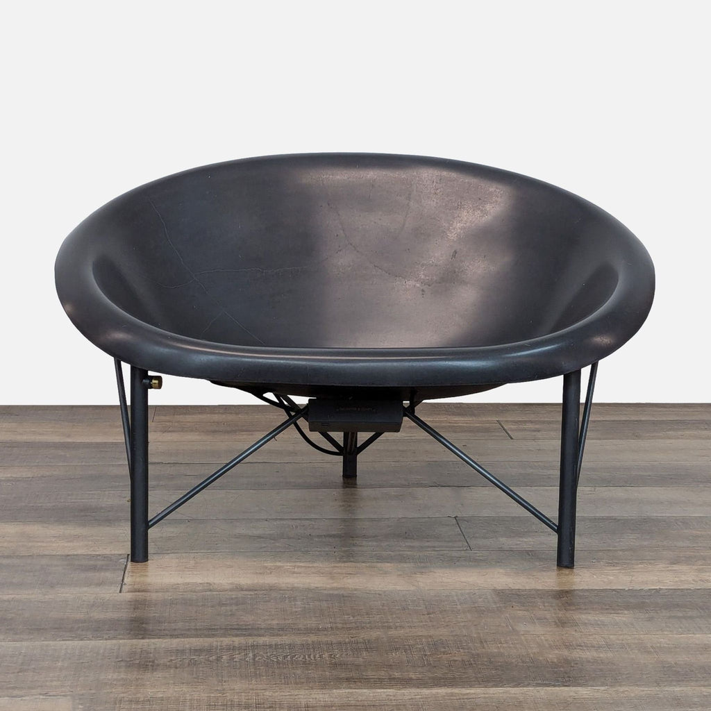 Front view of the Helios outdoor chair with a cast stone seat and metal legs.