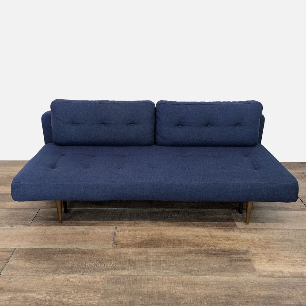 Room & Board Deco sofa with tufted upholstery, converts to sleeper.