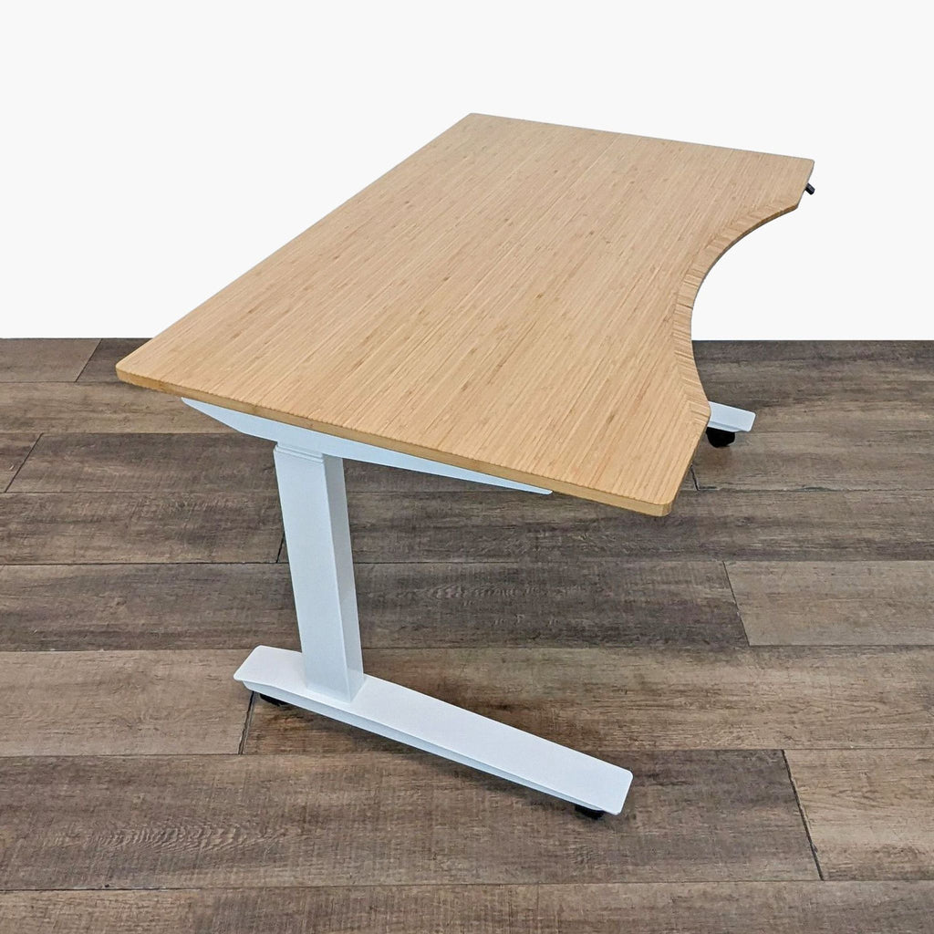 Height-adjustable desk with curved bamboo top and sturdy white metal base.