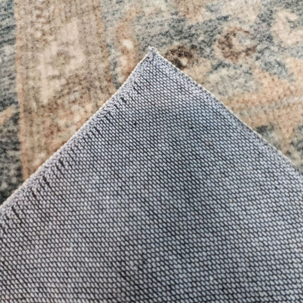 3. Rug with visible backing corner, showcasing fine weaving detail.