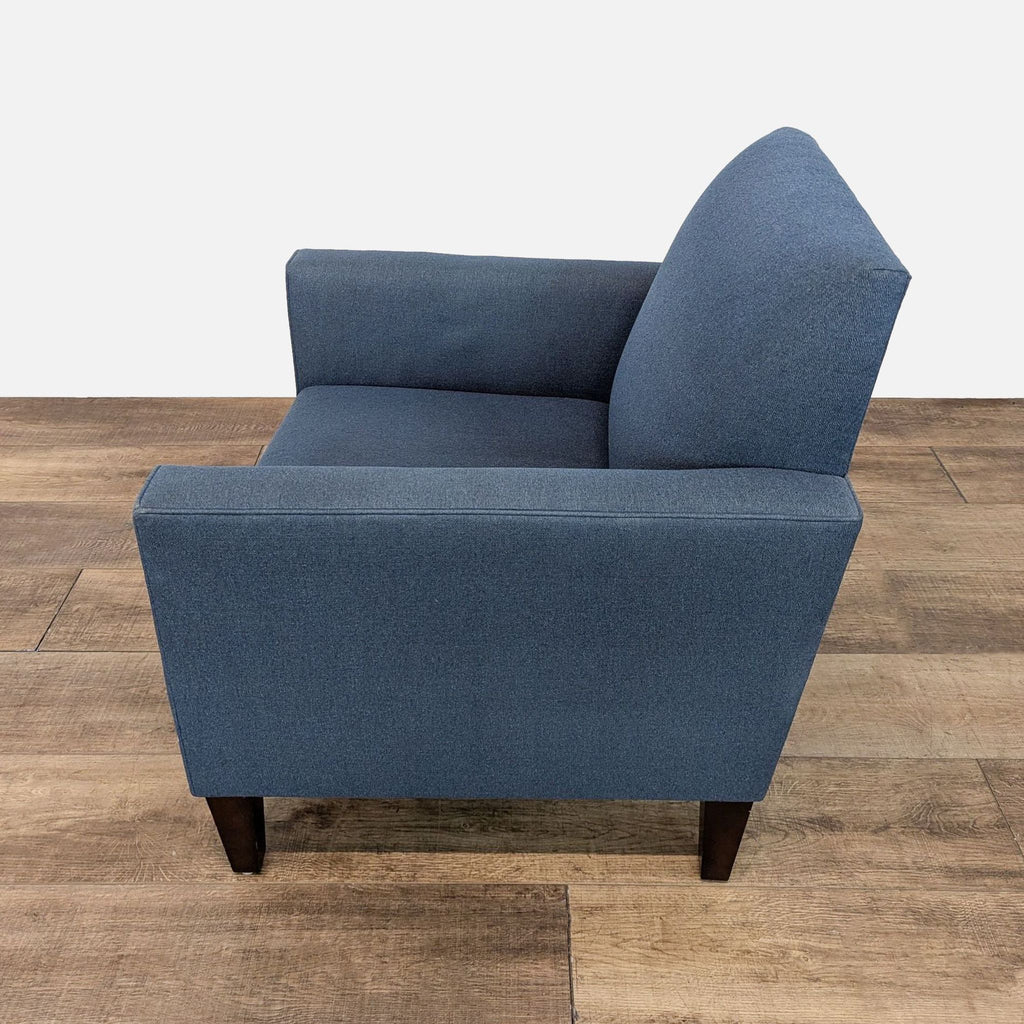 Lounge chair by Crate & Barrel, blue upholstery, side angle.
