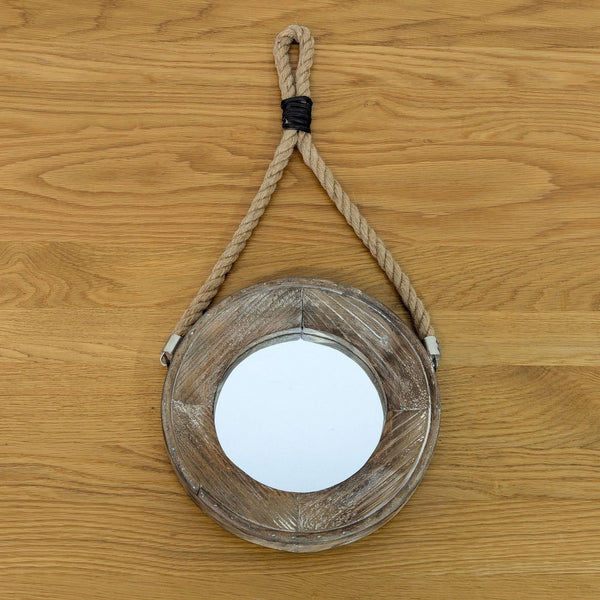 Round mirror with a rustic wooden frame and rope hanger on a wooden background. Brand: Heritage Home.