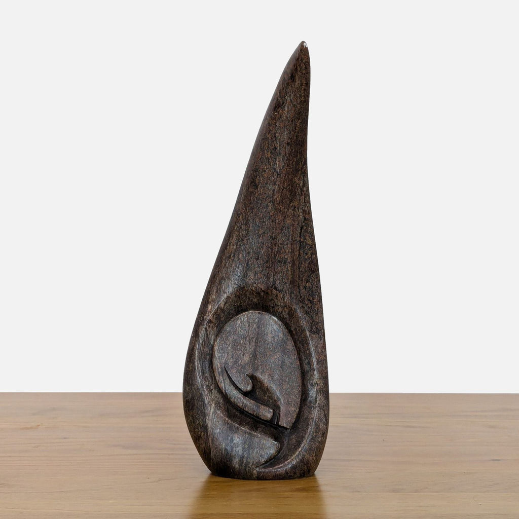 Mutare Serpentine sculpture with abstract carving symbolizing ancestral spirits.