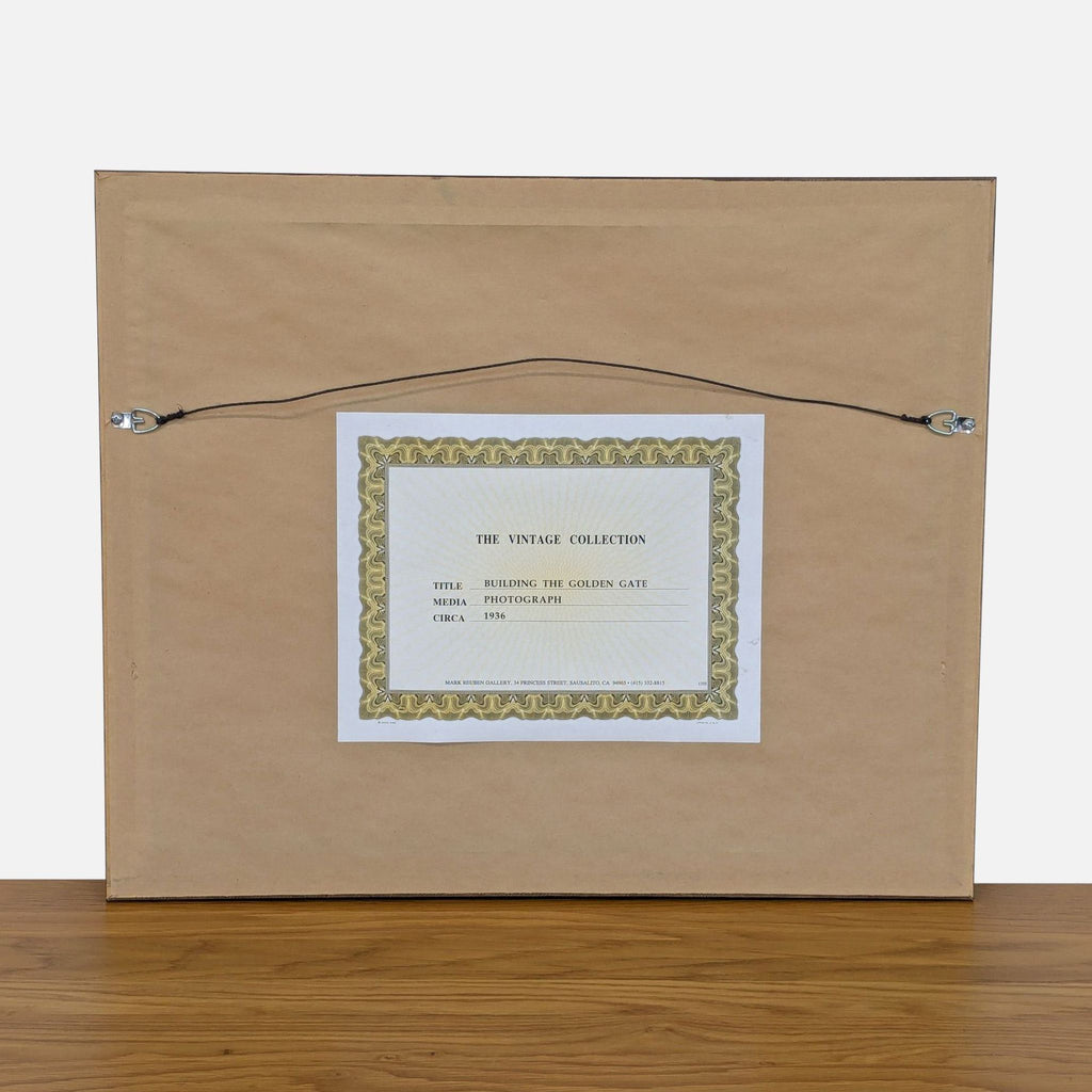 Back of framed photo titled "Building the Golden Gate," "The Vintage Collection."