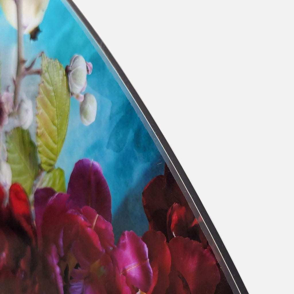 Close-up of "Tonda 2" print shows vivid floral details on a blue background by Isabelle Menin.