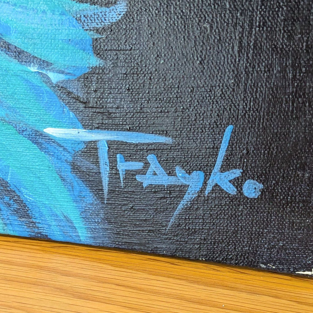 Artist Trayko Popov's signature in blue on a canvas of his original tiger painting.