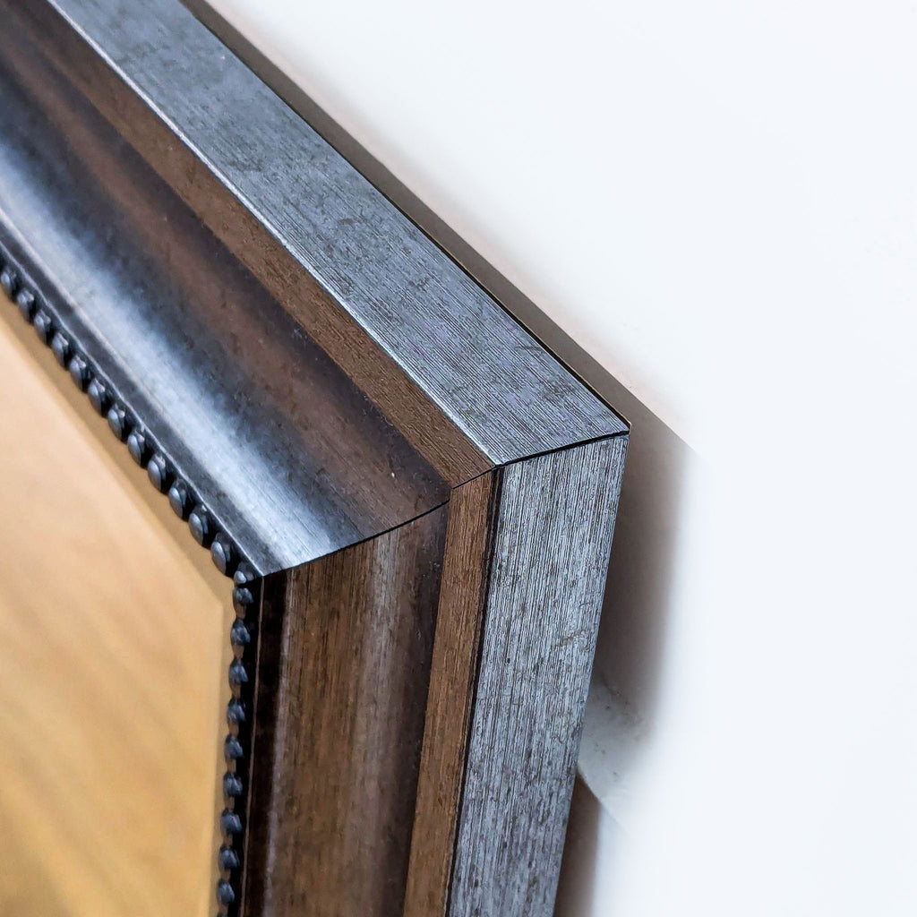 Close-up of the Reperch mirror’s wooden frame corner detail.