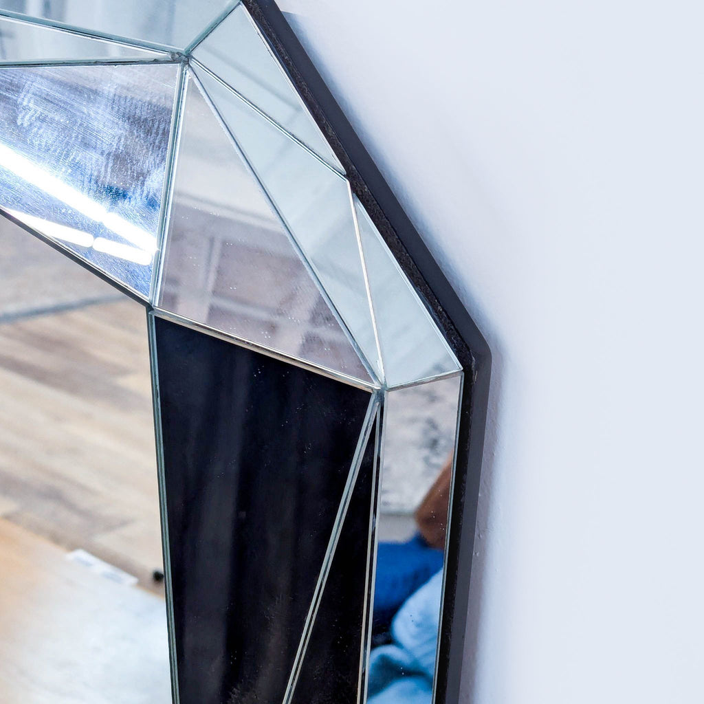 Close-up of beveled edges on an Art Deco inspired West Elm mirror.