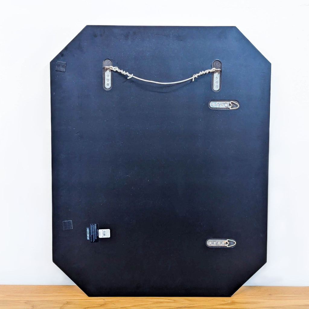 Back view of West Elm Art Deco mirror with mounting hardware.