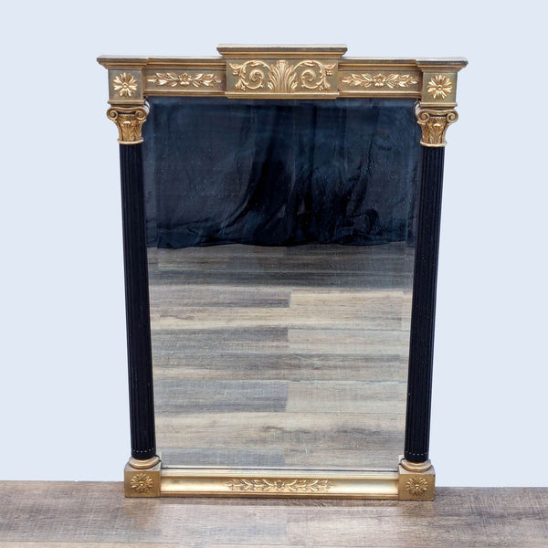 Carved mirror with gilding and black fluted columns, by Reperch.