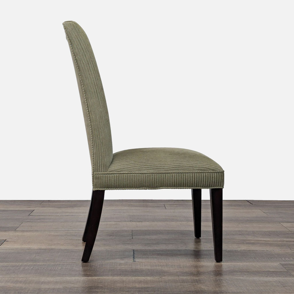 Restoration Hardware dining chair in green upholstery, side profile showing tall back and dark legs.