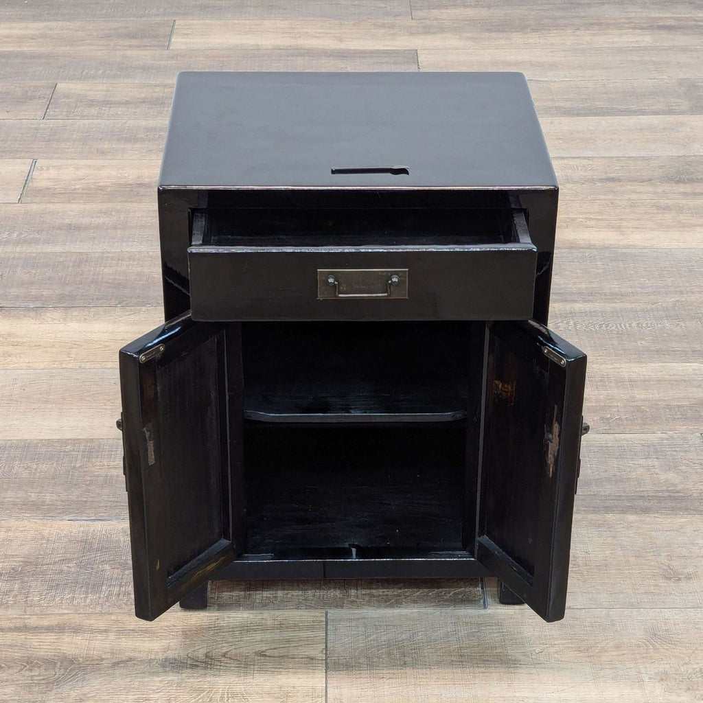 Open wood nightstand showing drawer and shelves, with metal hardware.