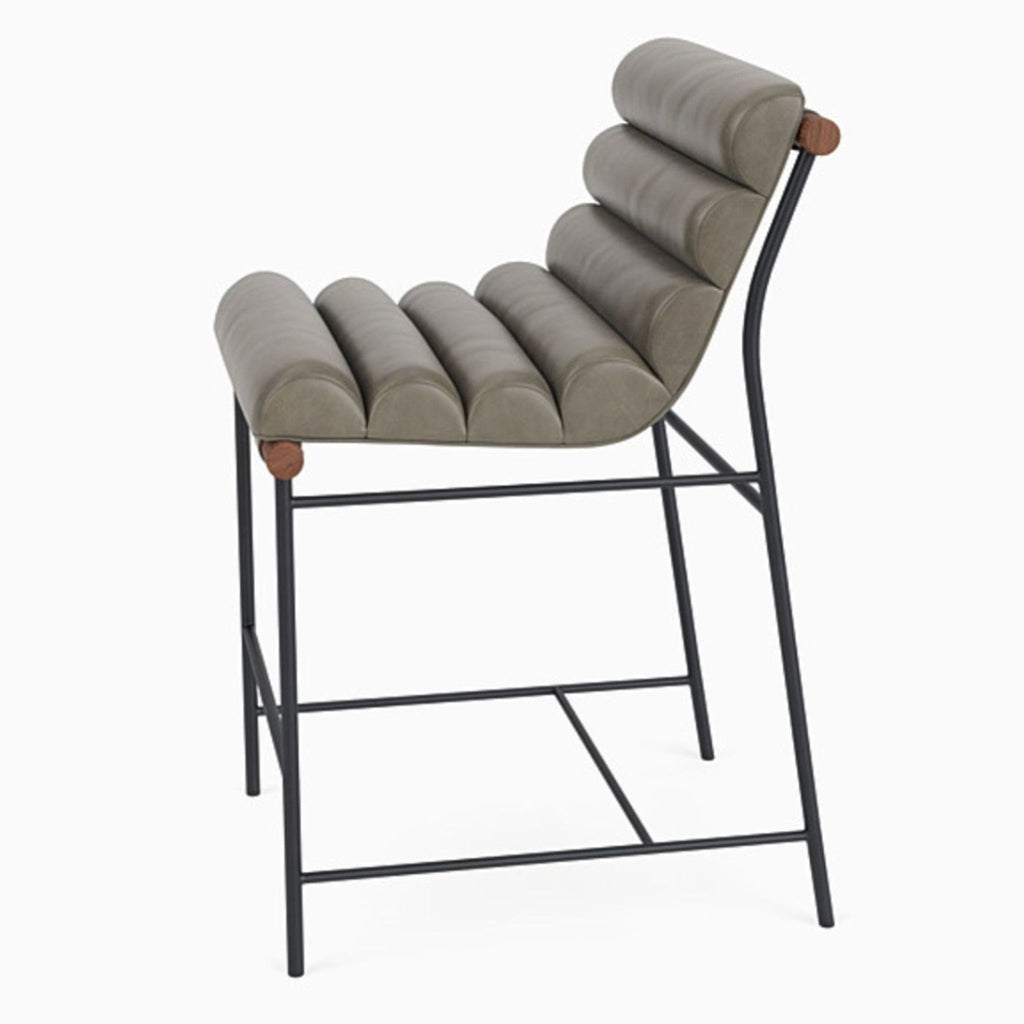 Side view of Vail Counter Stool with ergonomic leather seating and powder-coated steel frame.