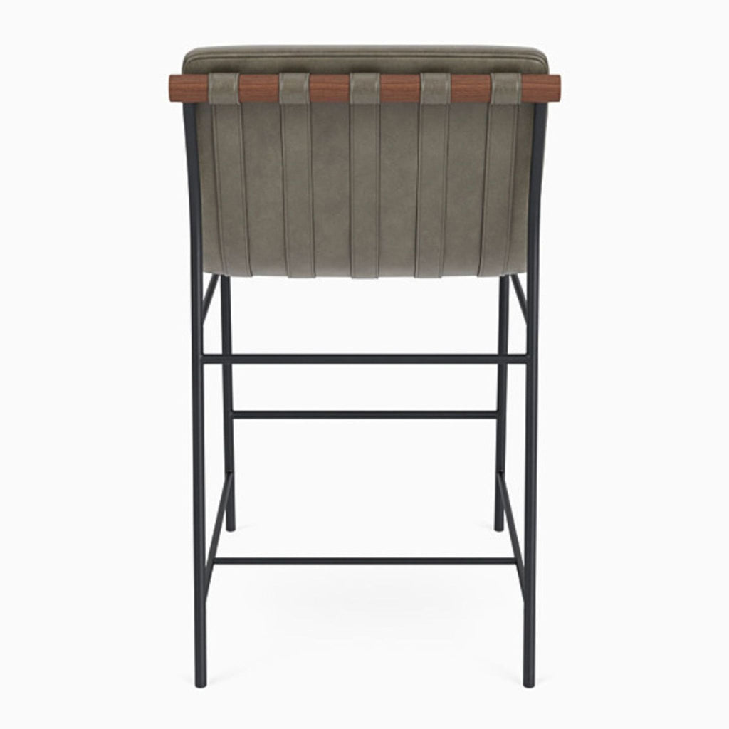 Back view of Vail Counter Stool showing leather upholstery and walnut dowel detailing.