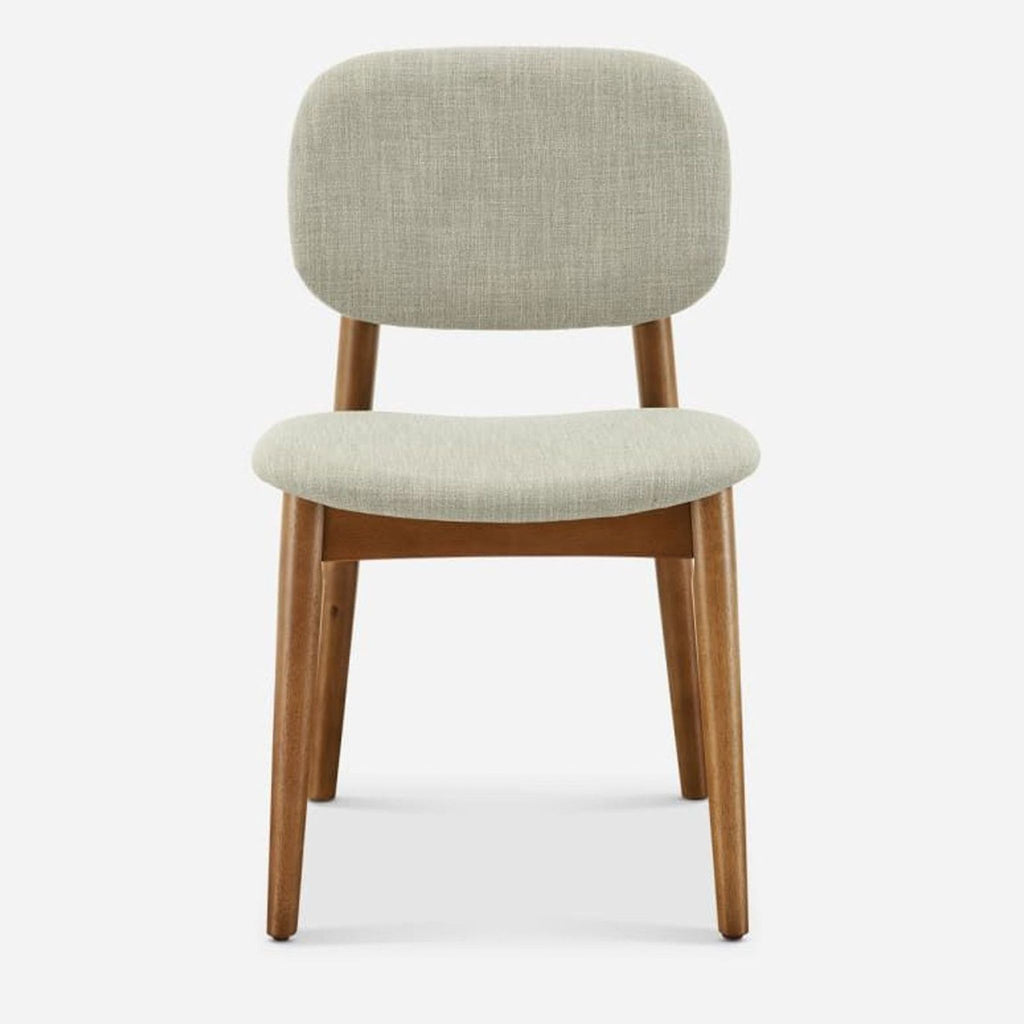 Front view of a Castlery dining chair, rubberwood frame with light fabric upholstery.