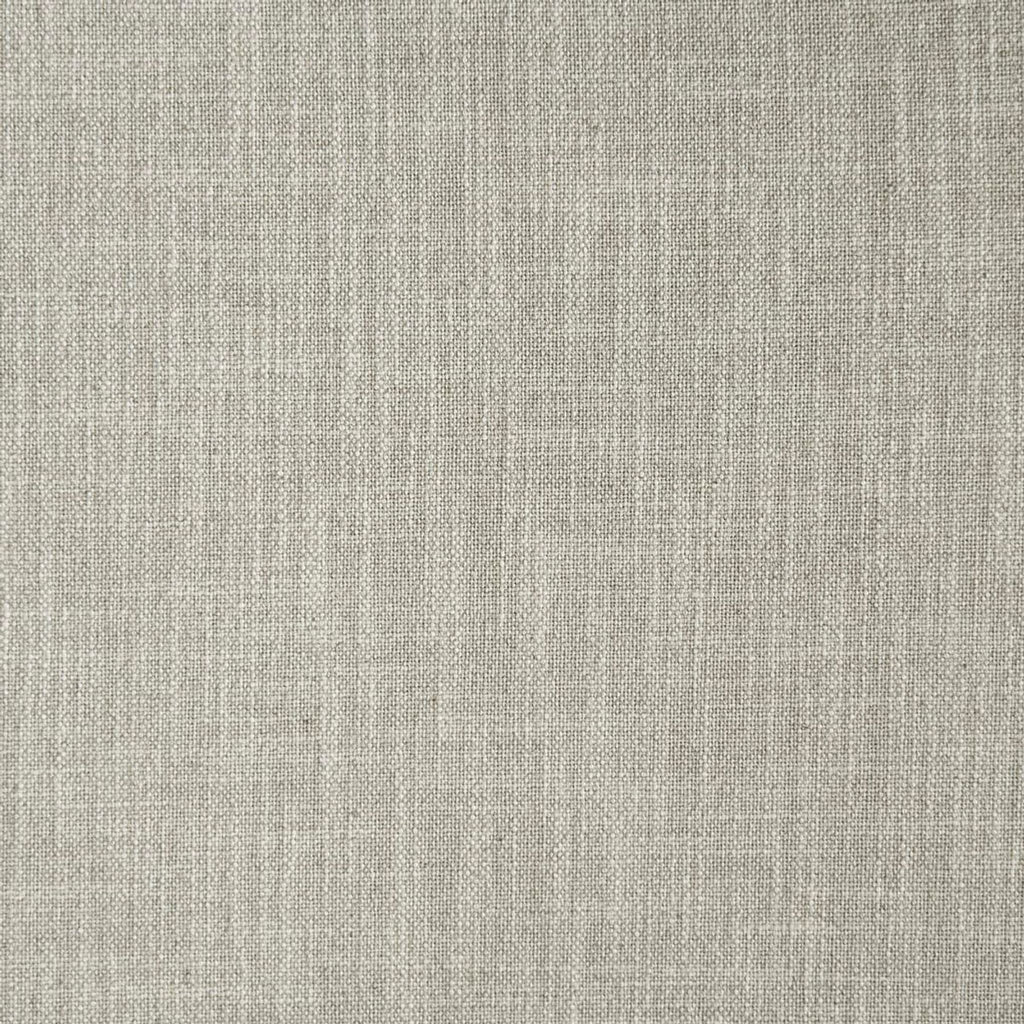 Close-up of textured light fabric used for chair upholstery.