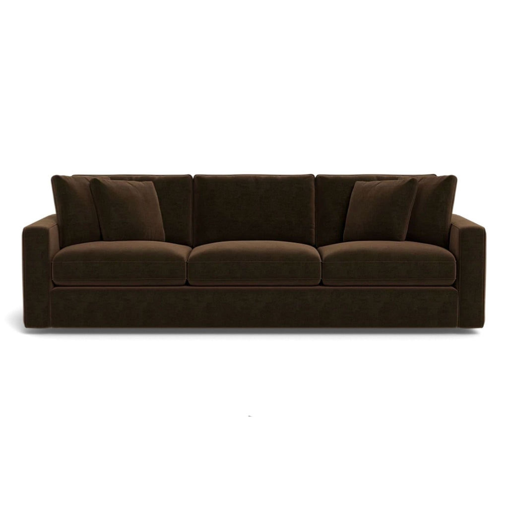 Havenly 3-seat sofa with wide arms, structural piping, and concealed legs.