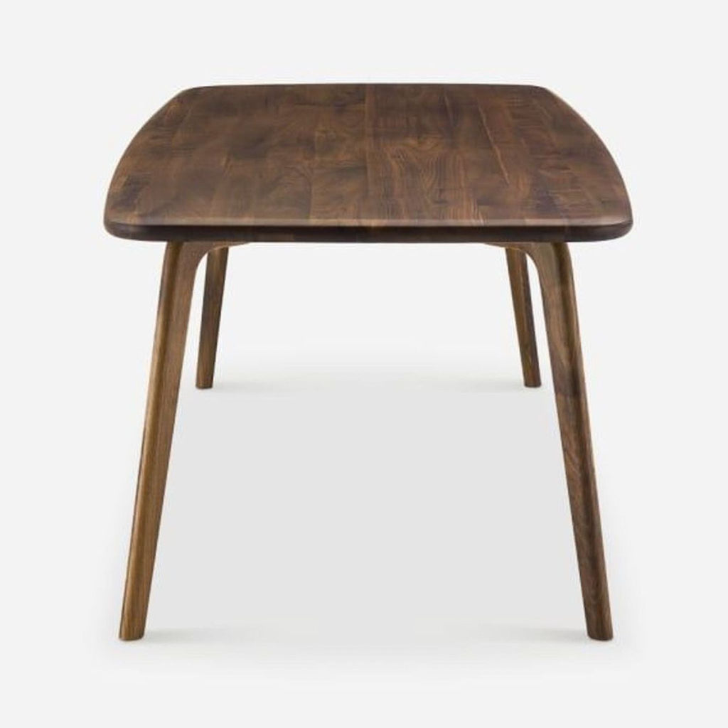 Elegant dining table by Castlery, crafted from solid American walnut with a minimalist design.