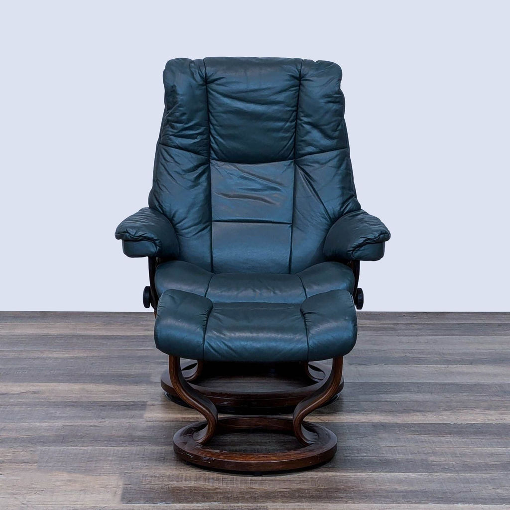 Front view of a blue lounge chair with dark wood base.