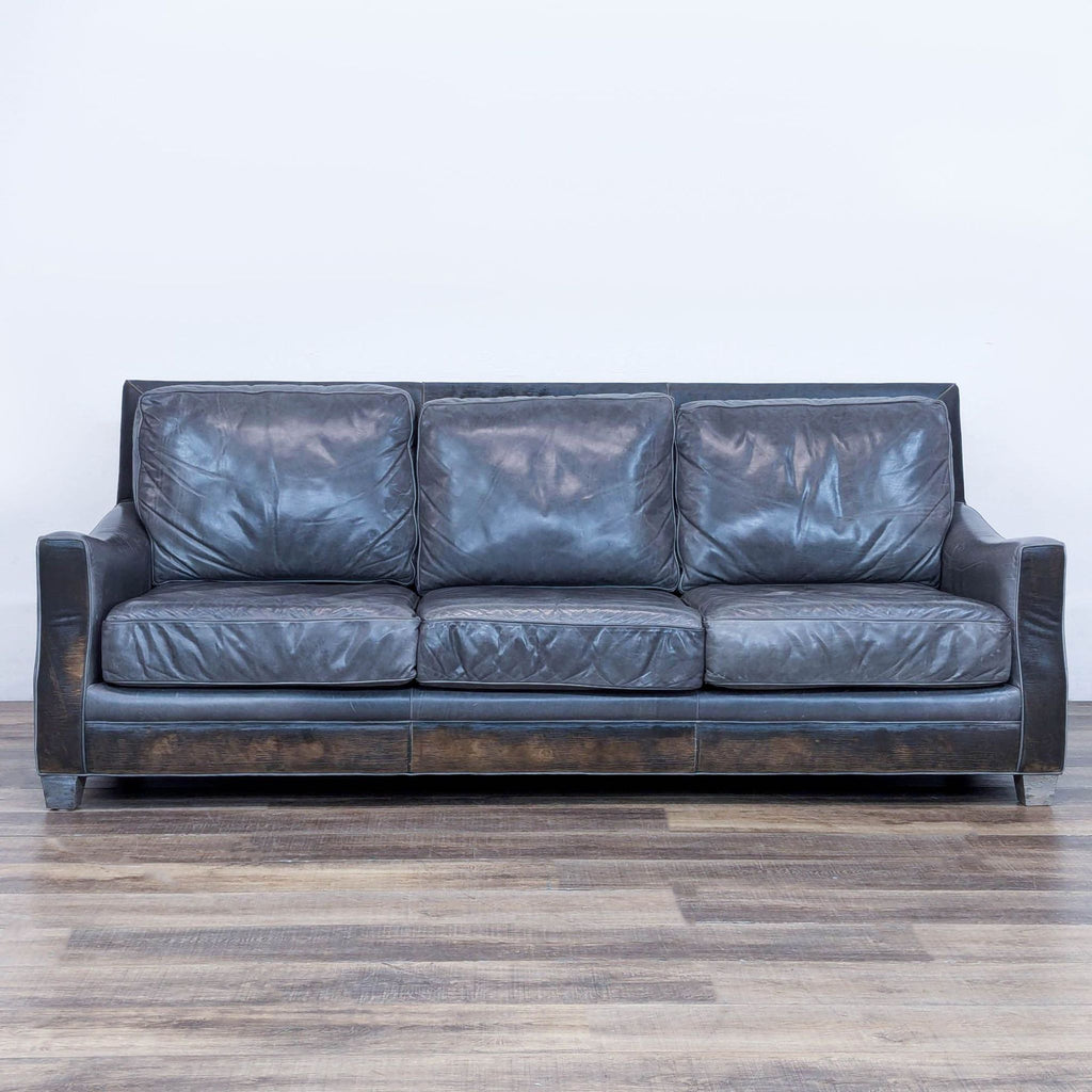 Front view of a 3-seat Menlo Park sofa with distressed leather and wood feet.