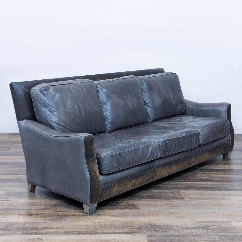 Angled view of Menlo Park sofa highlighting distressed leather and elegant design.