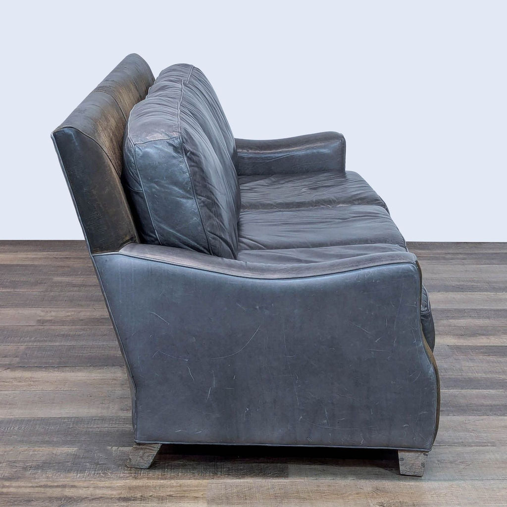 Side view of the Menlo Park sofa showing loose cushions and tapered wood feet.