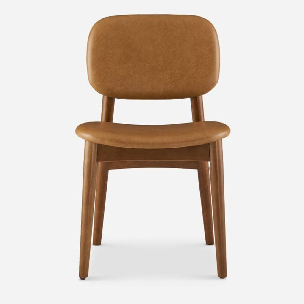 Front view of a caramel leather dining chair with walnut-stained rubberwood legs.