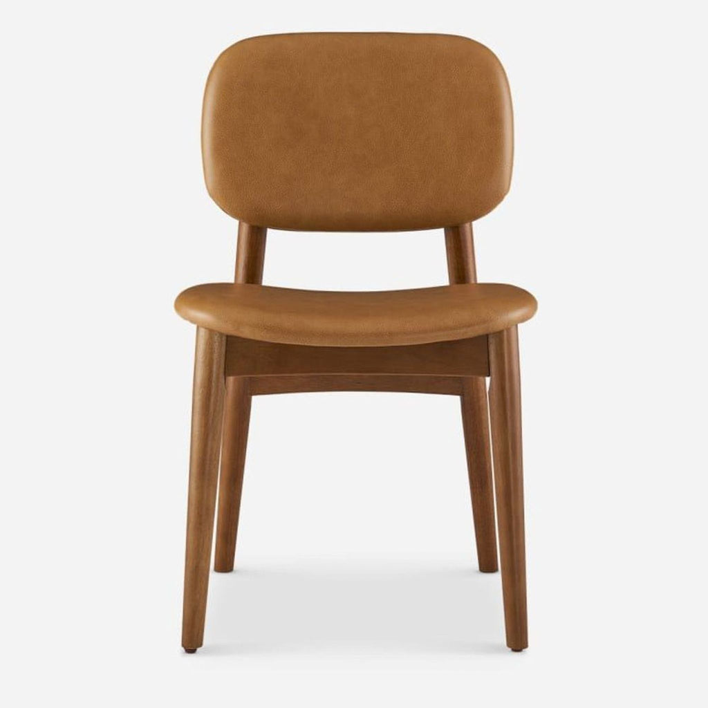 Front view of a caramel leather dining chair with walnut-stained legs.