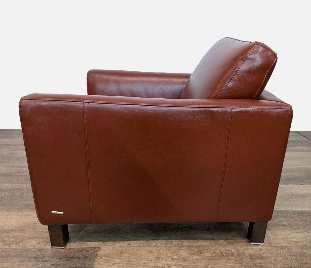 Natuzzi lounge chair, side profile with wood feet.
