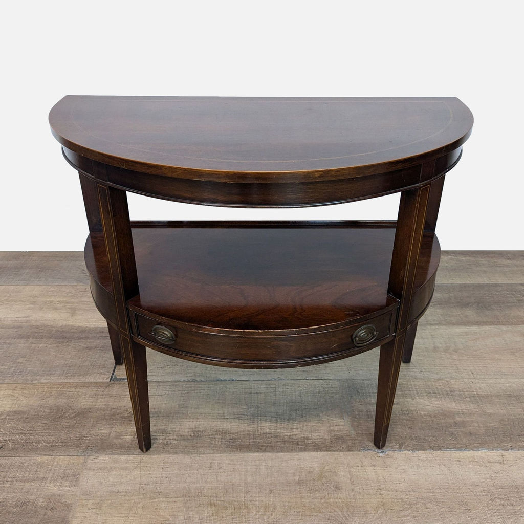 Demilune two-tier table with a drawer, crafted by Brandt of Hagerstown.