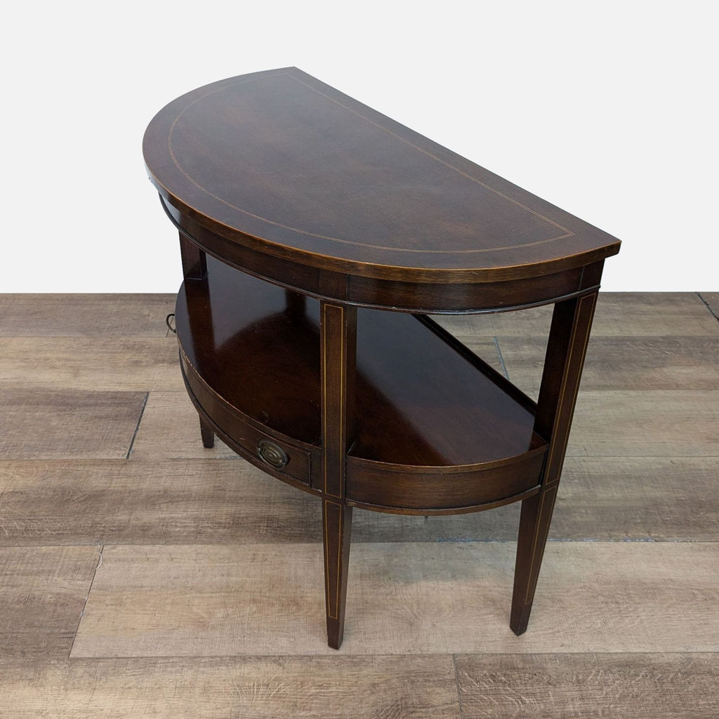 Elegant side table featuring two levels and a central drawer for storage.