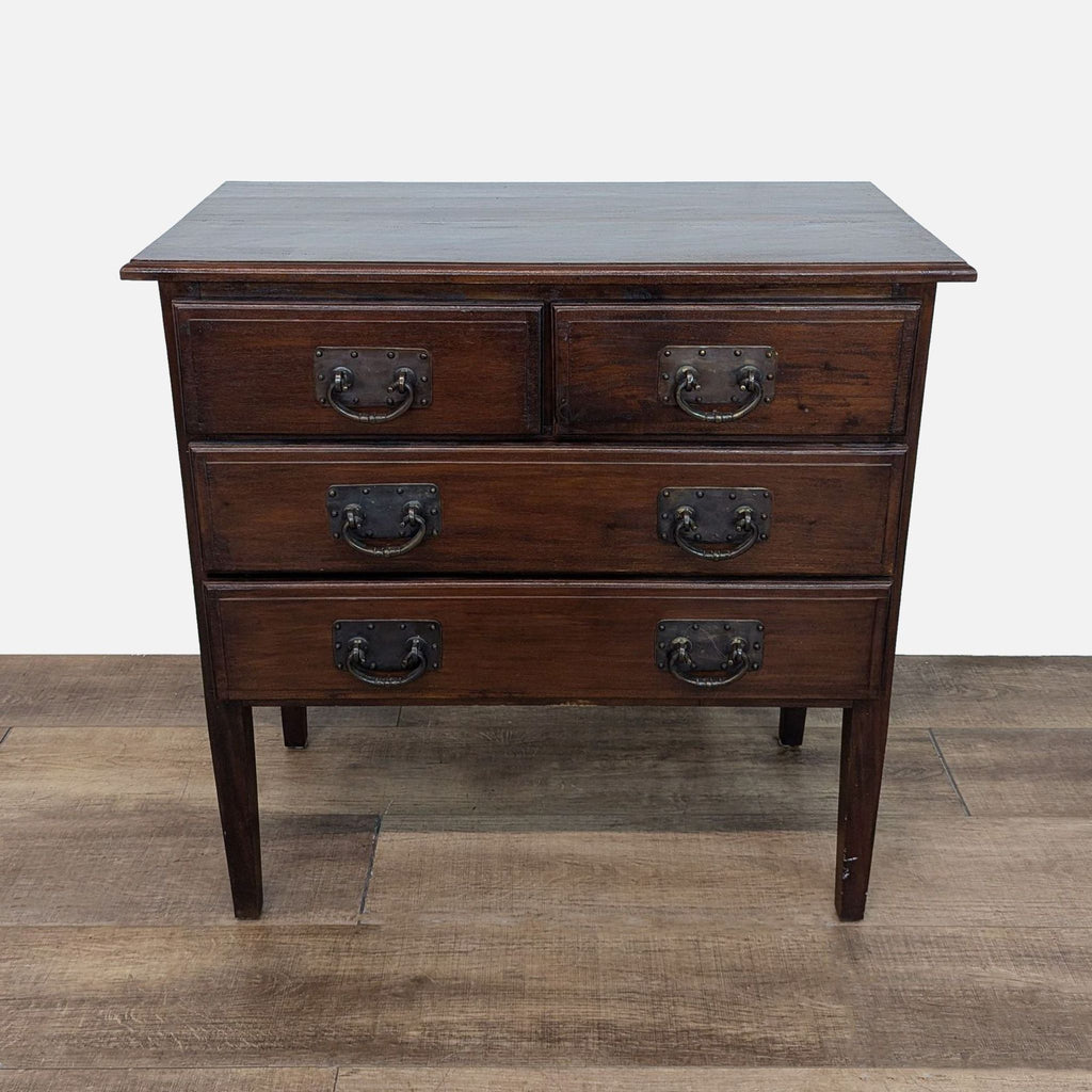 Front view of a dark Reperch dresser with metal pulls and tall legs.