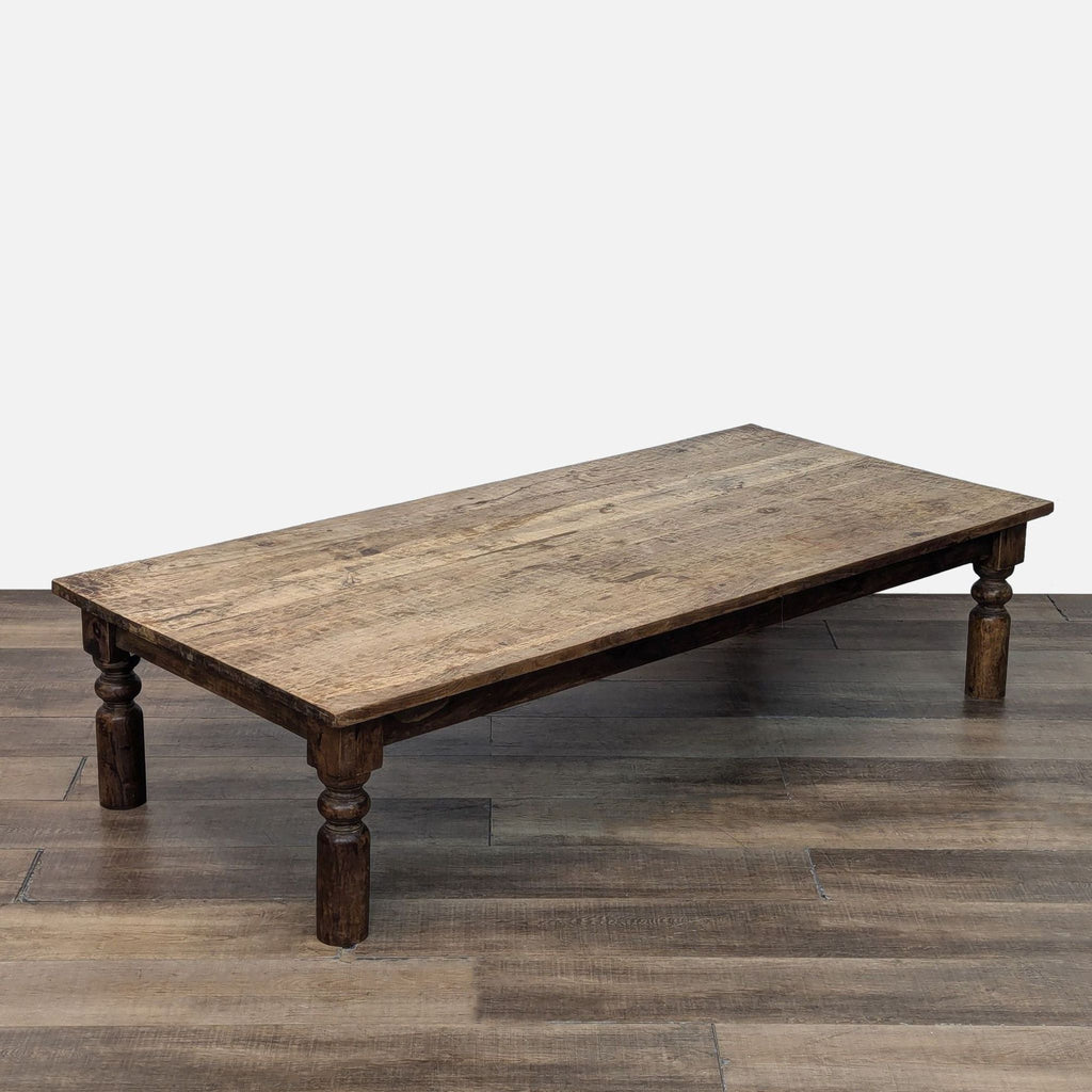 Wooden table with turned legs, designed by Reperch for a classic coffee setting.
