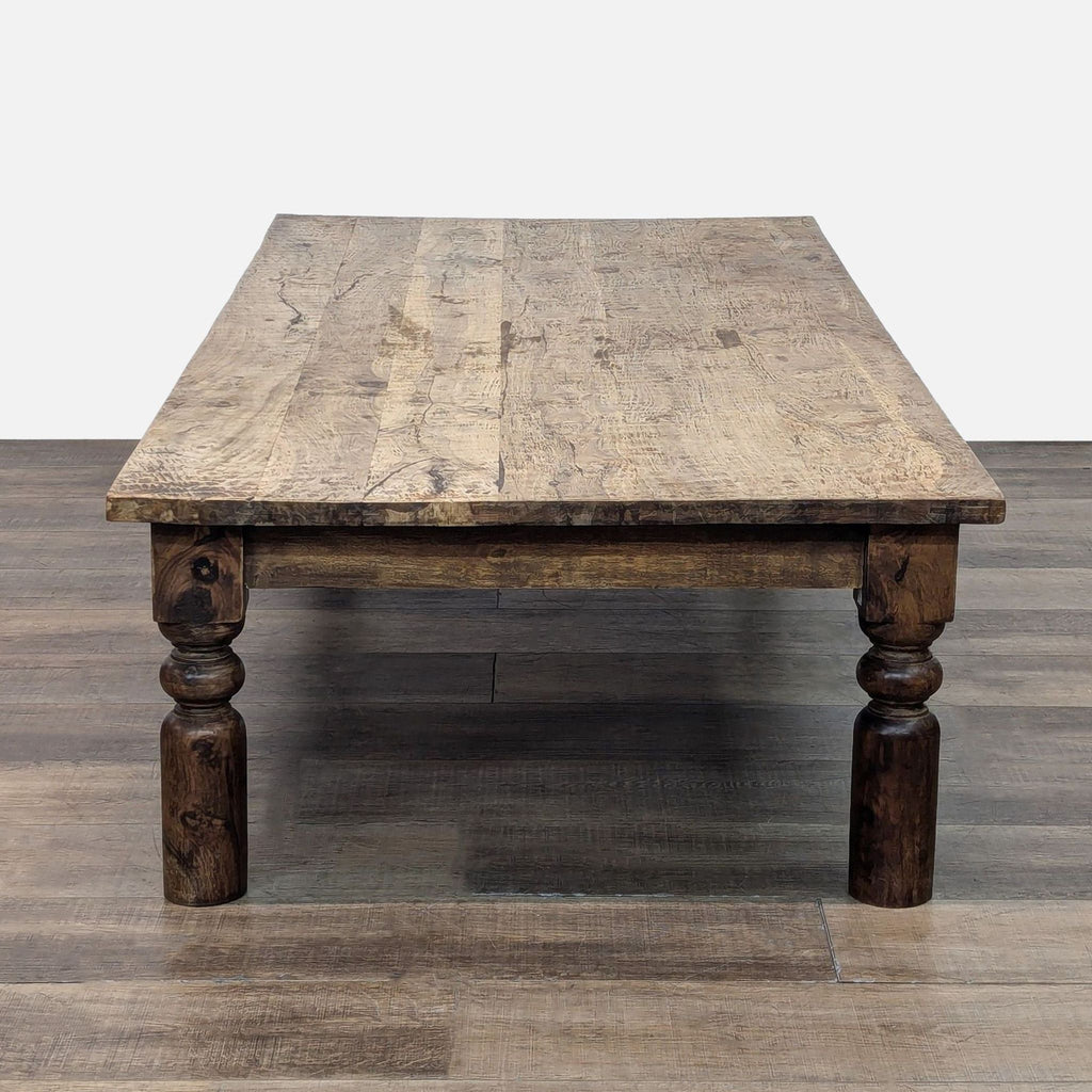 Plank top coffee table by Reperch, featuring elegant turned legs.